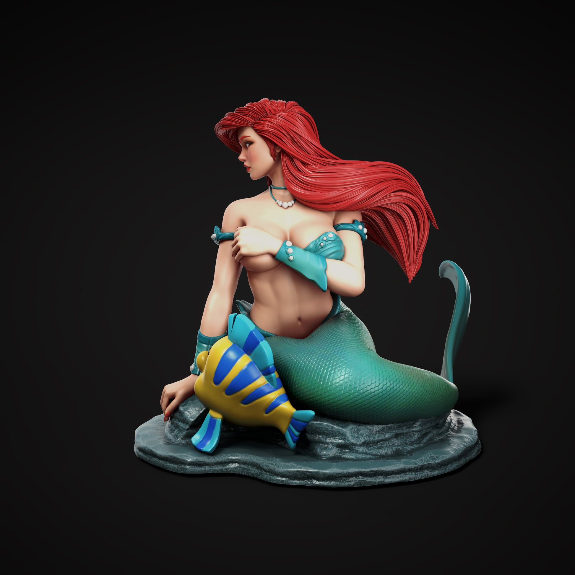 Ariel from Disney’s The Little Mermaid with her long red hair and green mermaid tail, alongside her best friend Flounder the tropical fish.