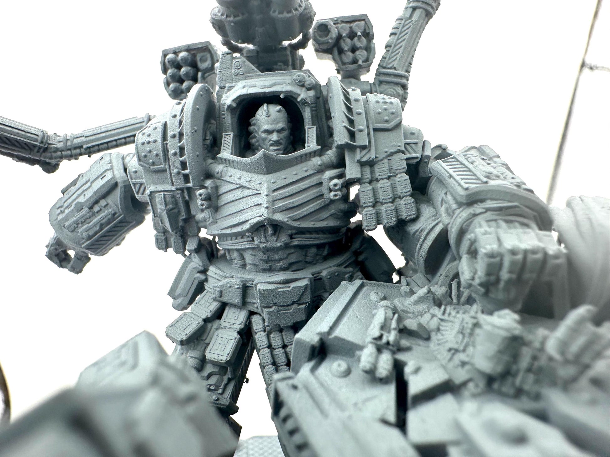 Primarch Perturabo of the Iron Warriors in full battle armour smashing Fulgrim's face